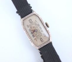 An early 20th century silver cocktail watch, possibly French, the rectangular dial with canted