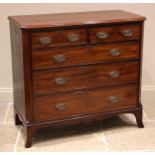 An early 19th century mahogany chest of drawers, the rectangular moulded top with canted front