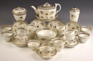 A Caughley tea service, circa 1790, comprising: a teapot, cover and stand, nine tea bowls, nine