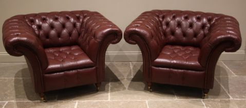 A pair of Chesterfield red leather tub chairs, late 20th/early 21st century, each of deep seated