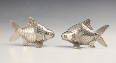 A pair of silver plated articulated fish, the fish with hinged fins and articulated realistically