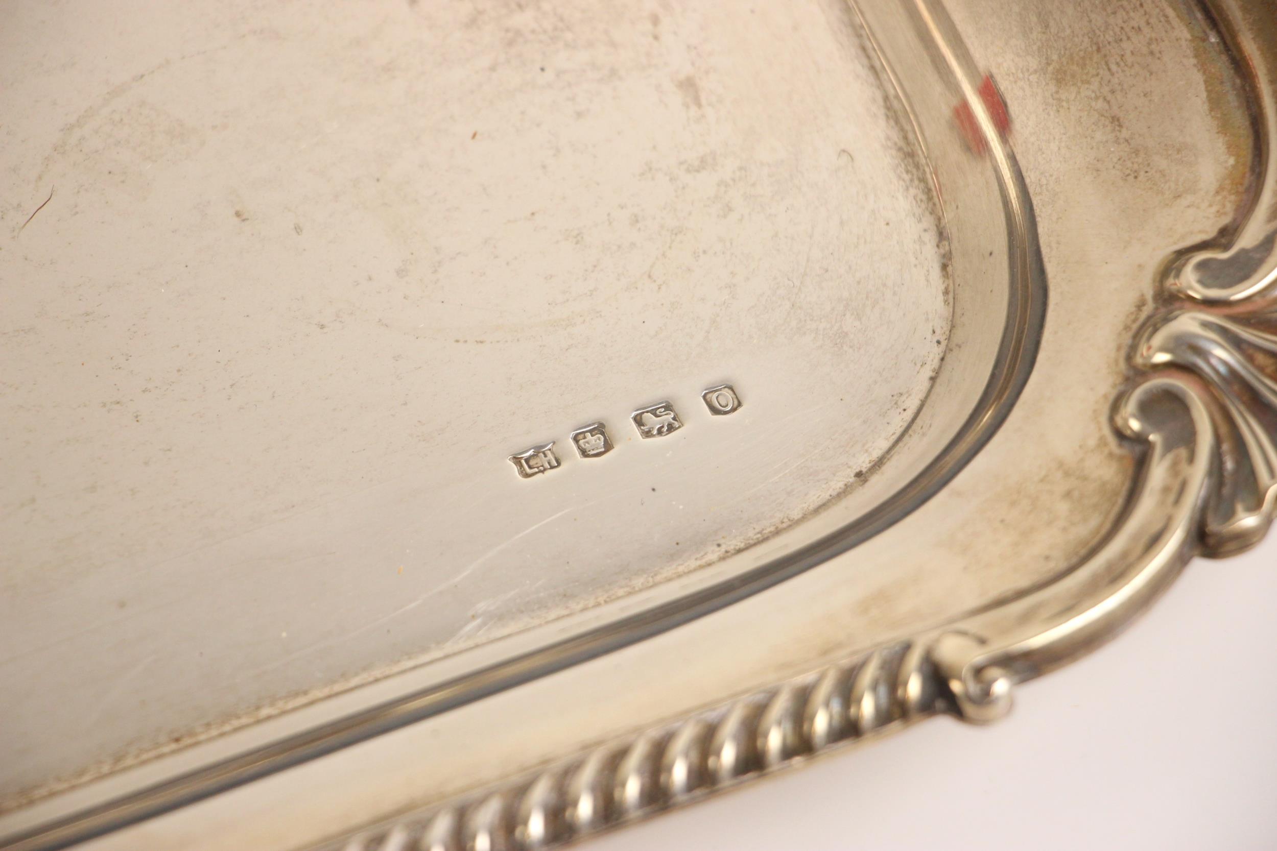 A George V silver tray, L Harrison, Sheffield 1931, the shaped twin handled tray with shell shaped - Image 2 of 3