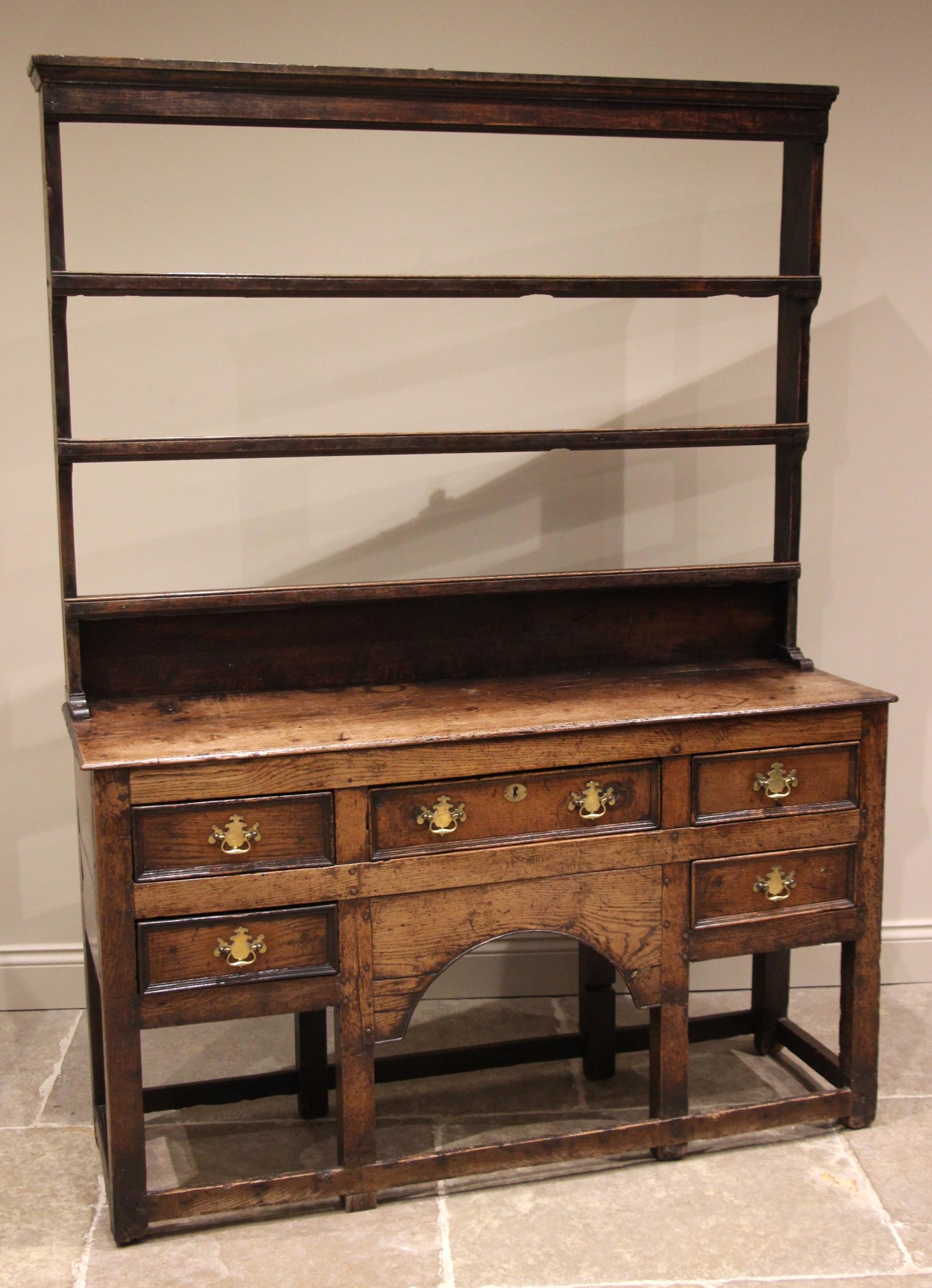 An 18th century oak dresser, the open plate rack with a moulded cornice and plain frieze over - Image 4 of 5