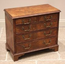 A figured walnut chest of drawers, 19th century and later, of cottage proportions, the moulded top