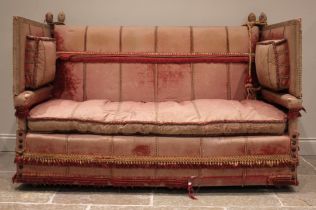 An 18th century knoll or Knole sofa, in pink velour fabric applied with tassel fringes, the straigh