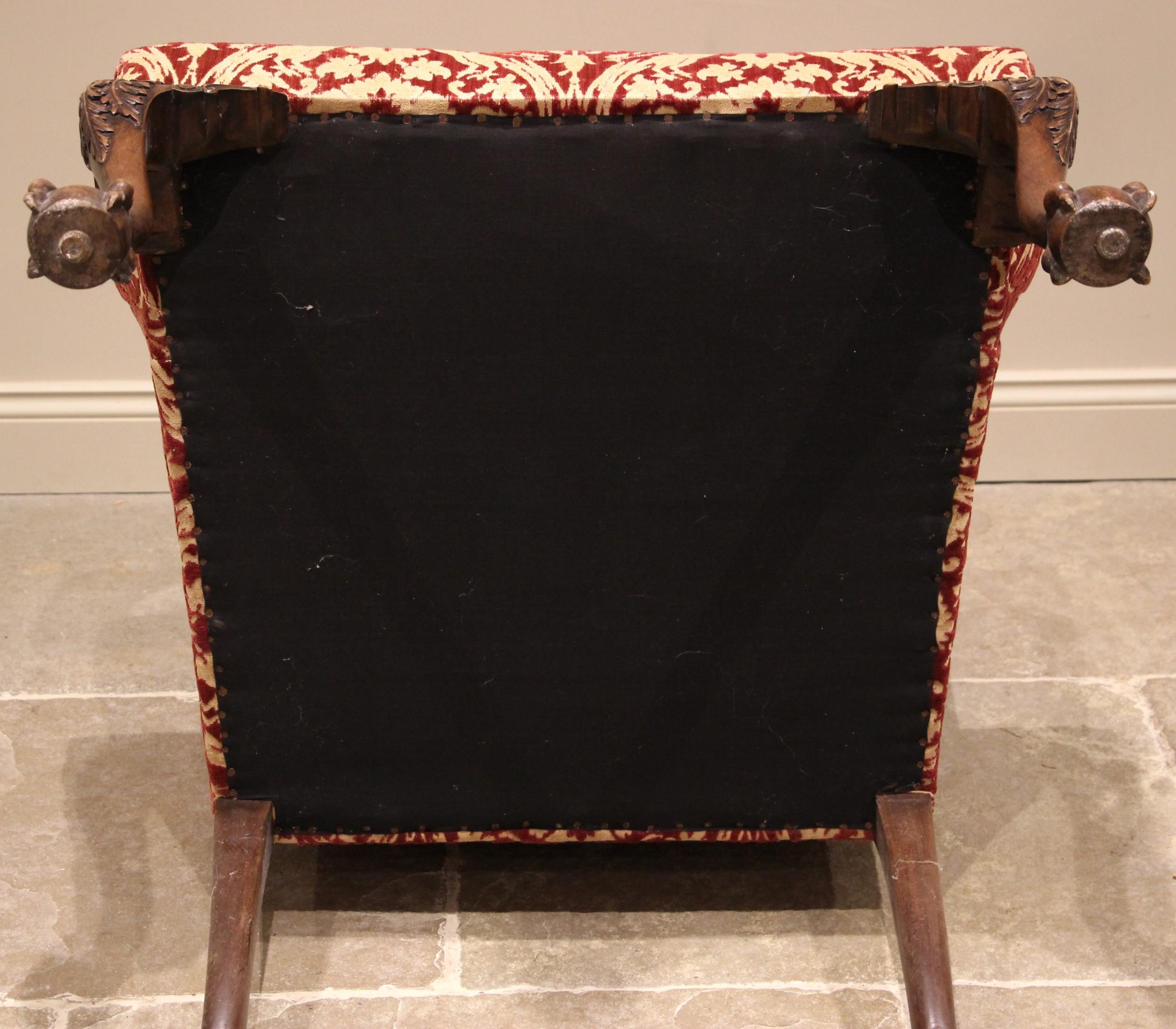 A George III style wing back armchair, mid 20th century, of country house proportions, in embossed - Image 3 of 3