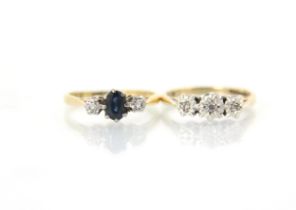 An Edwardian style untested sapphire and diamond three stone ring, the central oval cut blue stone