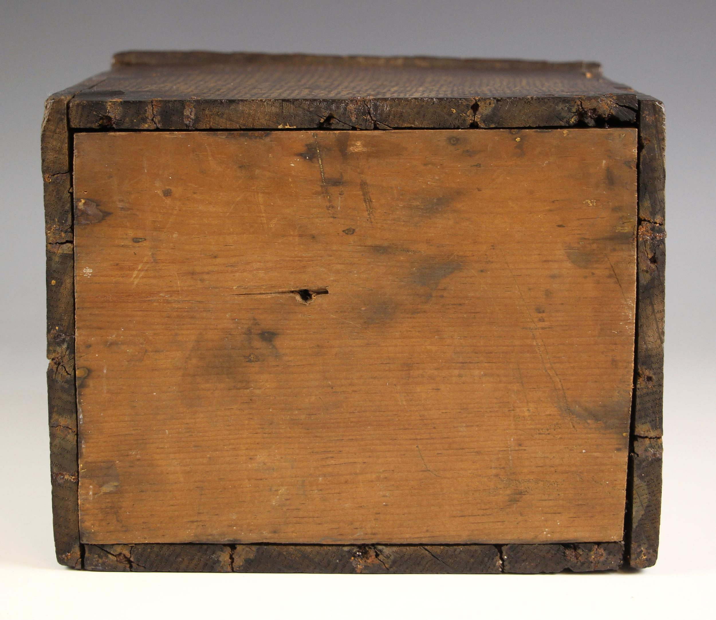 An 18th century oak candle box, the shaped back over a sloping hinged cover, later pine base, 36cm H - Image 2 of 2