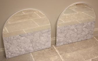 A pair of Carrera marble mirrored splash backs, early 21st century, each with a demi lune bevelled
