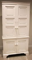 A 19th century painted pine housekeepers cupboard, formed with a pair of panel moulded cupboard