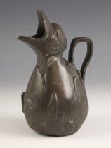 An Art Nouveau pewter jug, modelled as a chick hatching from an egg, the spout as its beak,