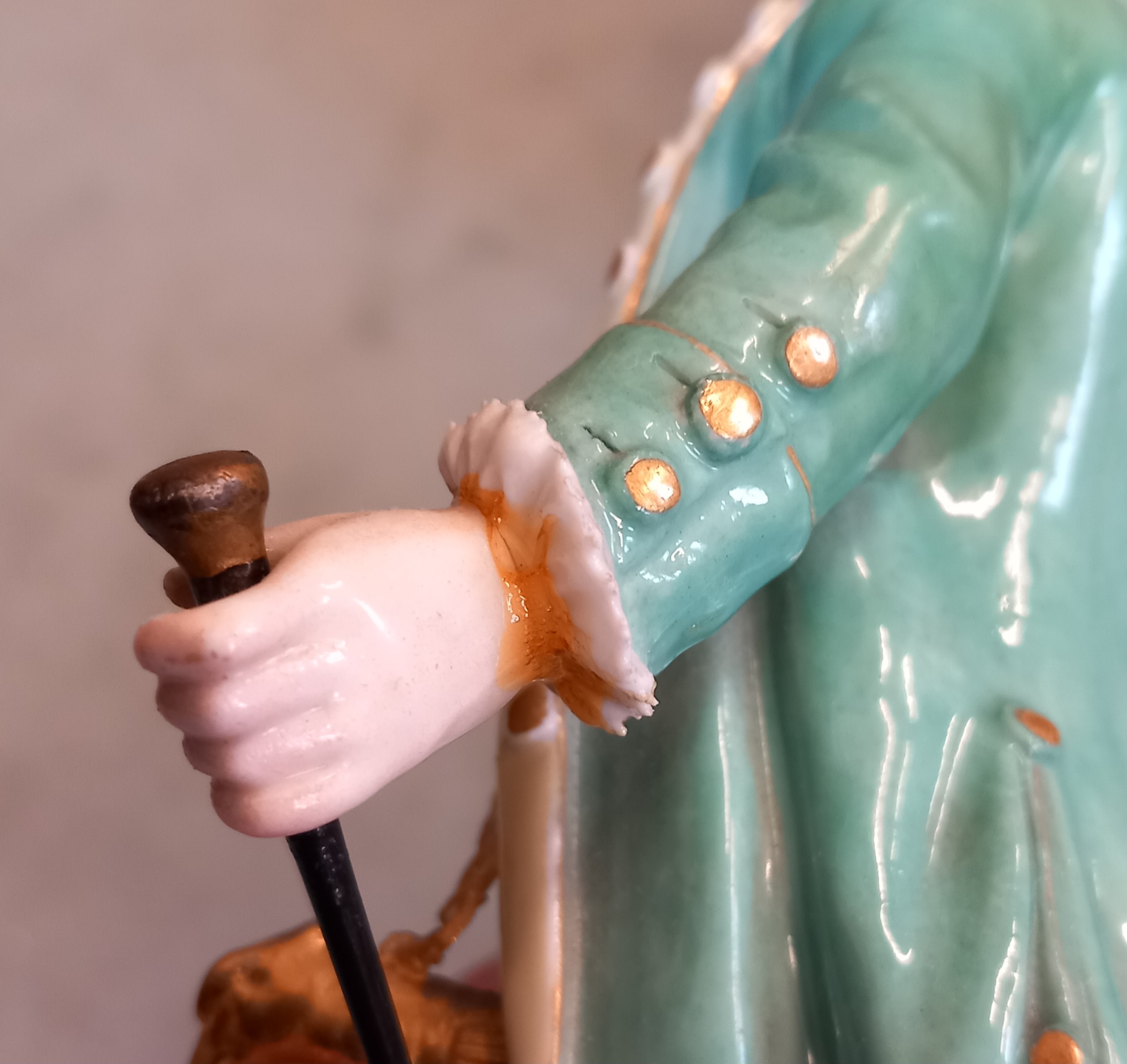 A Meissen figure, 19th century, of a gentleman with tri-corn hat, turquoise overcoat and breeches - Image 6 of 10