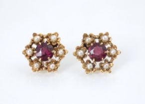 A pair of Edwardian style seed pearl and red stone earrings, the round cut red stones within