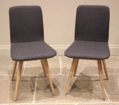 A pair of Gazzda dining chairs, by Heals, the curved seat and back rest in grey felt fabric, upon