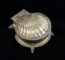 A Victorian silver gilt ink well, Robert Garrard, London 1881, designed as a shell, the hinged cover