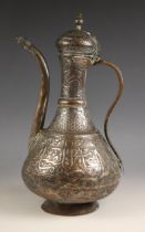 A 19th century copper ewer and cover, possibly Islamic, with typical geometric and and character