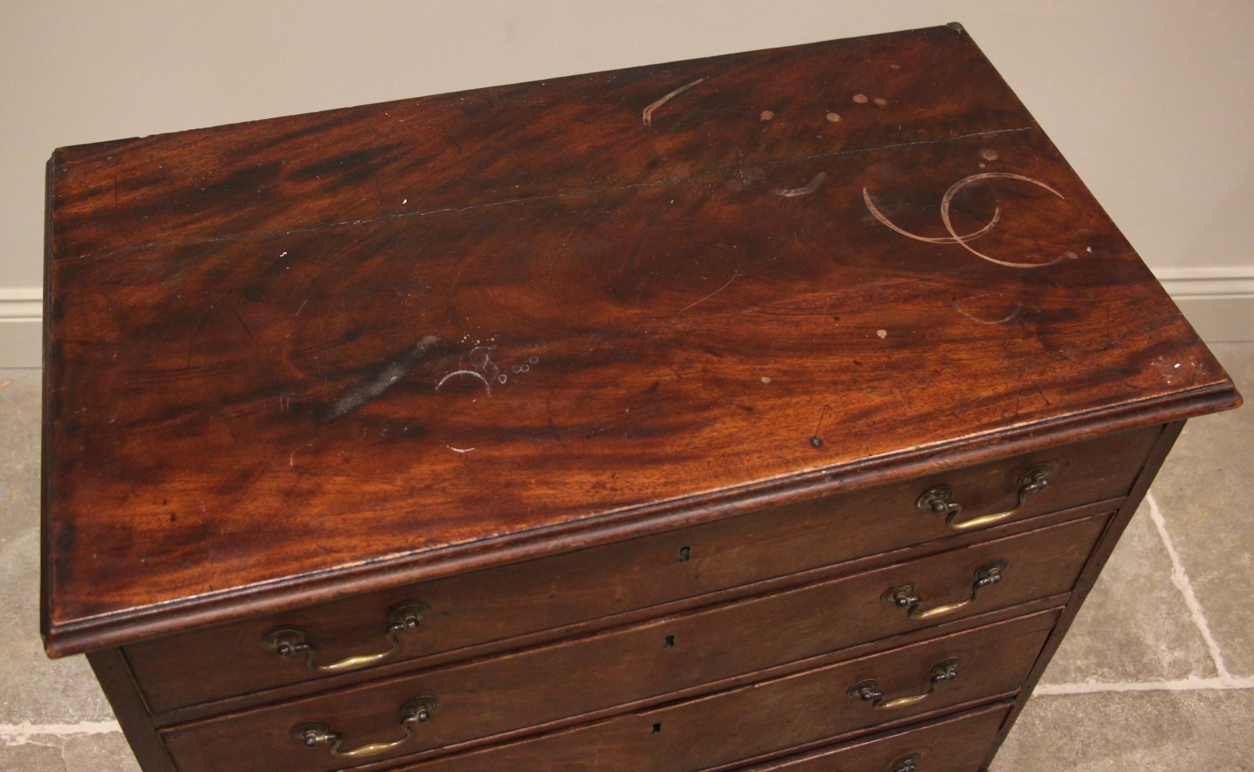A George III mahogany chest of drawers, the moulded top over four graduated and cock beaded long - Image 2 of 2