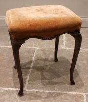 A George II style mahogany dressing stool, 19th century, the upholstered seat with a serpentine