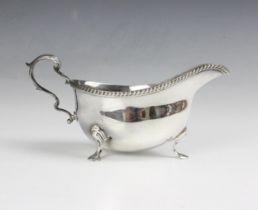 A silver sauce boat, Edward Barnard & Sons Ltd, London 1962, the gadroon rim above plain polished