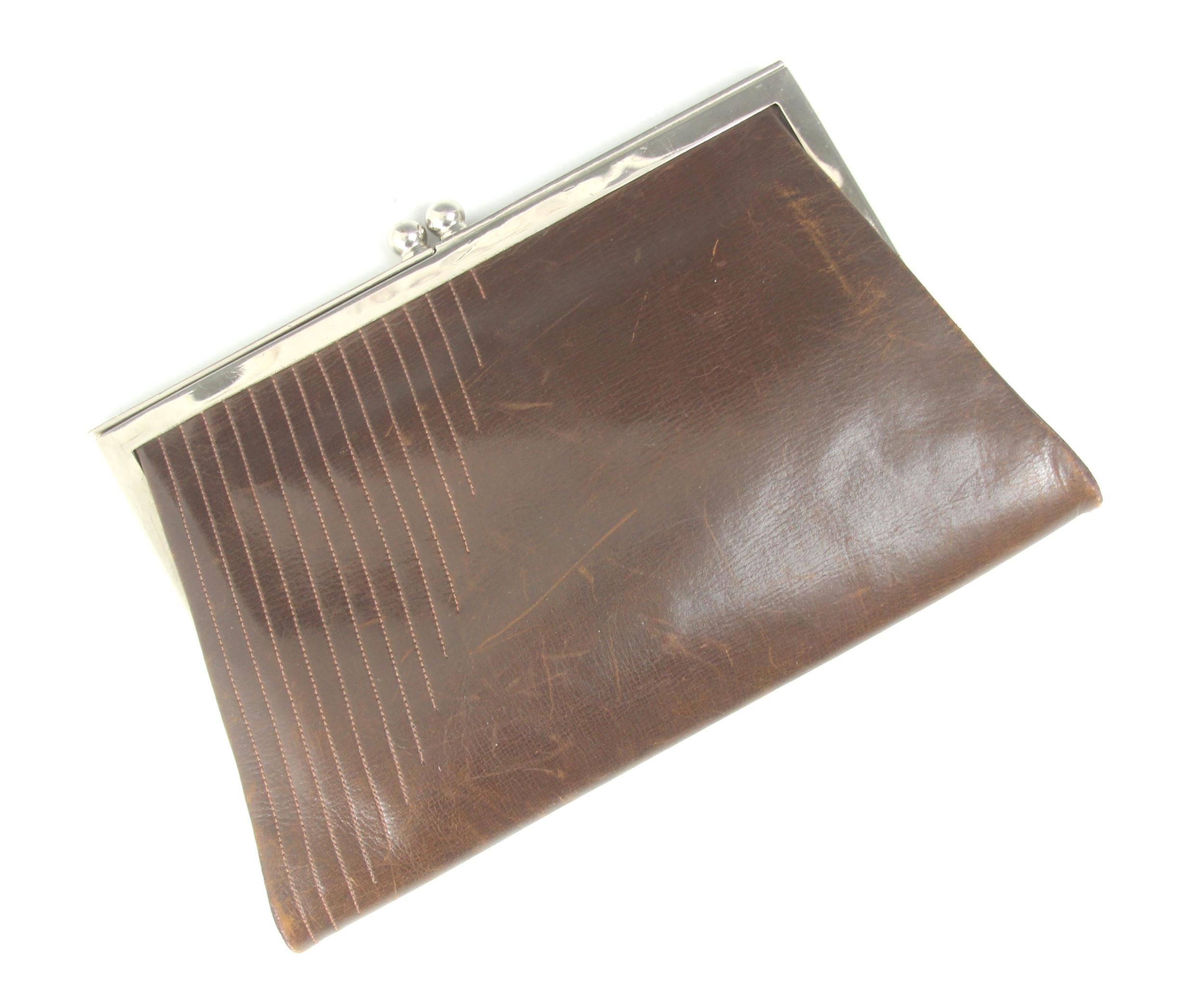 A 1930s brown leather clutch bag, white metal frame, with integral purses, a later clutch bag, - Image 2 of 5