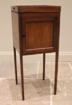 A George III mahogany tray top pot cupboard, the galleried top over a single panelled door, upon