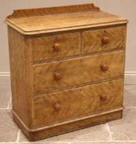 A Victorian scumbled pine chest of drawers, the rectangular top with rounded front corners and