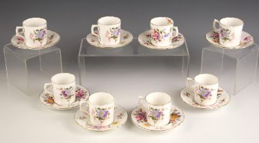 A Royal Crown Derby set of eight coffee cans and saucers, 20th century, each decorated with floral