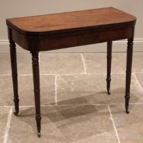 A George III mahogany folding card table, of 'D' form, the crossbanded top opening to a baize