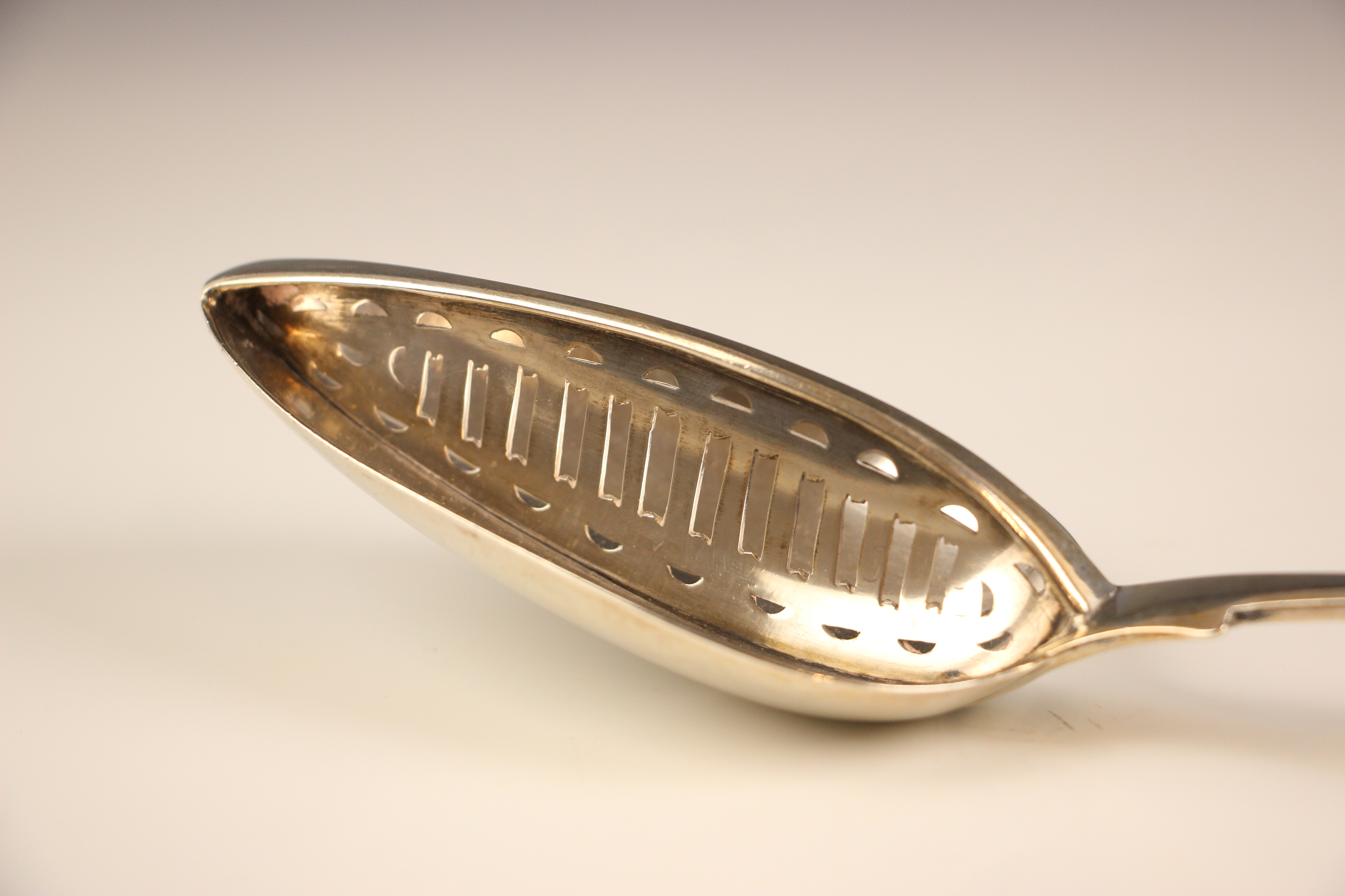 An Irish silver fiddle pattern straining spoon, Richard Sawyer, Dublin 1837, the bowl of the spoon - Image 3 of 5