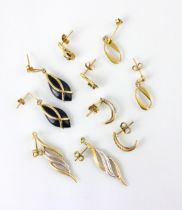 A group of five pairs of yellow metal and gold coloured earrings, including an openwork oval