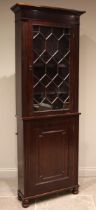 A 19th century mahogany library bookcase, the frieze applied with moulded roundels over the single