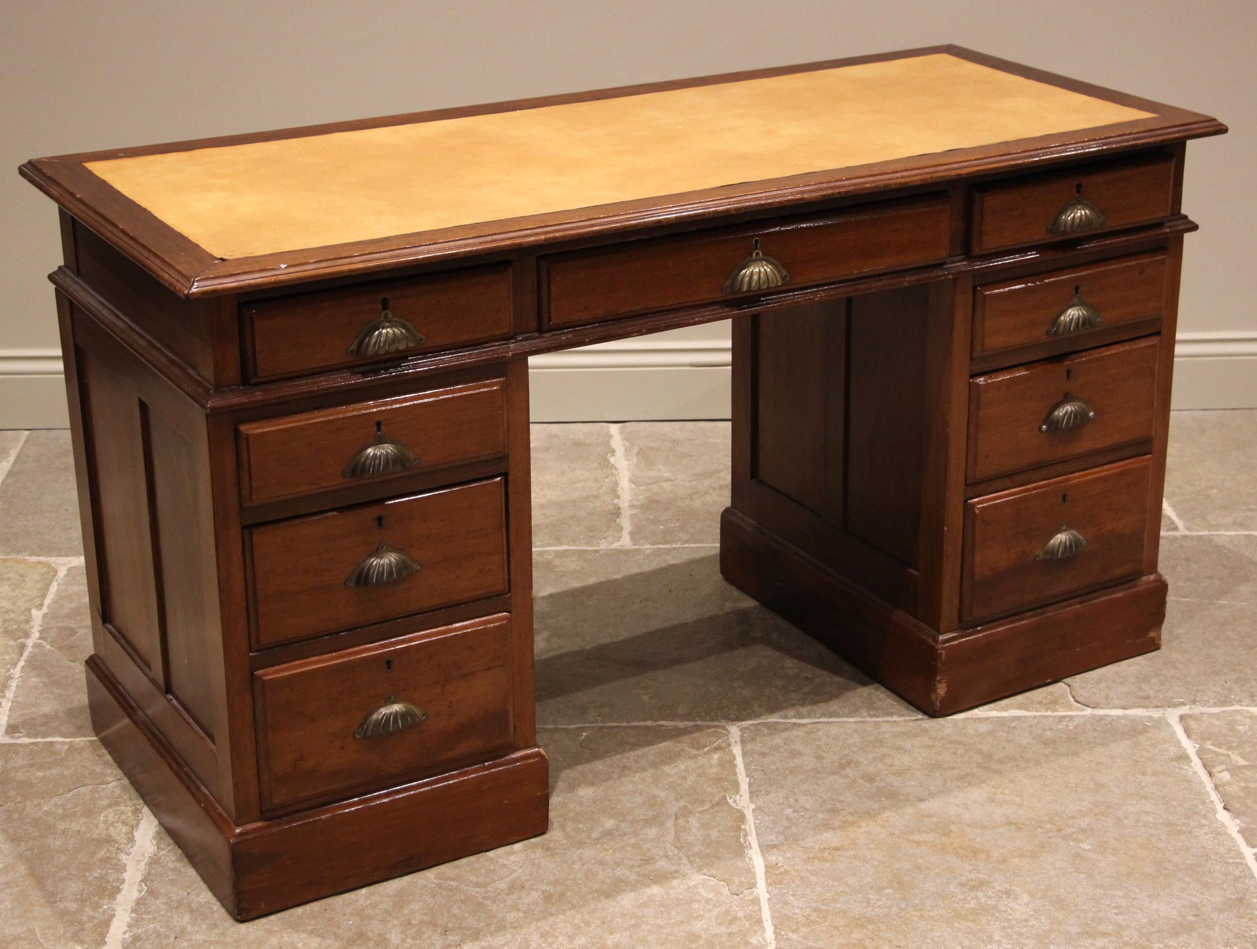 A Victorian mahogany twin pedestal desk, the rectangular top with a later leather inset skiver above