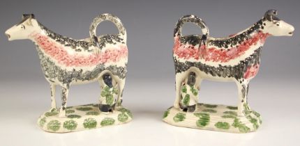 A pair of English Pottery pearlware cow creamers, circa 1810, with sponged decoration in pink and