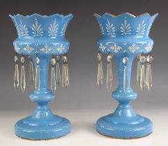 A pair of opaque blue glass lustres, late 19th century, painted white foliate decoration to the bow