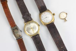 A group of four wristwatches, including a Waltham yellow metal cased example, the circular white