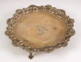 A George III silver salver, Ebenezer Coker, London 1762, the shell cast rim above monogram and crest