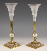 A pair of 19th century brass and copper epergnes, possibly continental, the weighted square bases