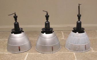 Three Simplex aluminum industrial light shades, mid 20th century, of typical domed form, below a