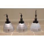 Three Simplex aluminum industrial light shades, mid 20th century, of typical domed form, below a