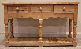 A Victorian style pine dresser, late 20th century, the plate rack with a moulded cornice over a