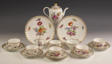 A Dresden porcelain part tea service, late 19th century, comprising: a milk jug, a sugar bowl, a hot