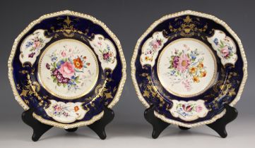 A pair of Bloor Derby bowls, circa 1825, the well painted with a spray of flowers enclosed by cobalt