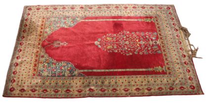 A Persian bamboo silk prayer rug, the central red field with a foliate urn, flanked by vertical