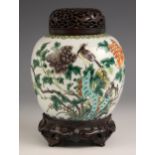 A Chinese porcelain famille vert ginger jar, cover, and stand, 19th century, the ovoid ginger jar