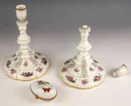 A pair of KPM Berlin porcelain candlesticks, 20th century, the urn shaped sconce leading to a