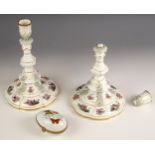 A pair of KPM Berlin porcelain candlesticks, 20th century, the urn shaped sconce leading to a