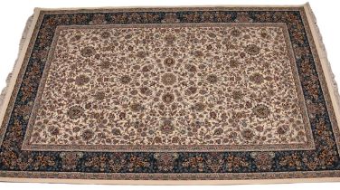 A fine woven Iranian carpet, full pile with all over floral design upon an ivory coloured ground,