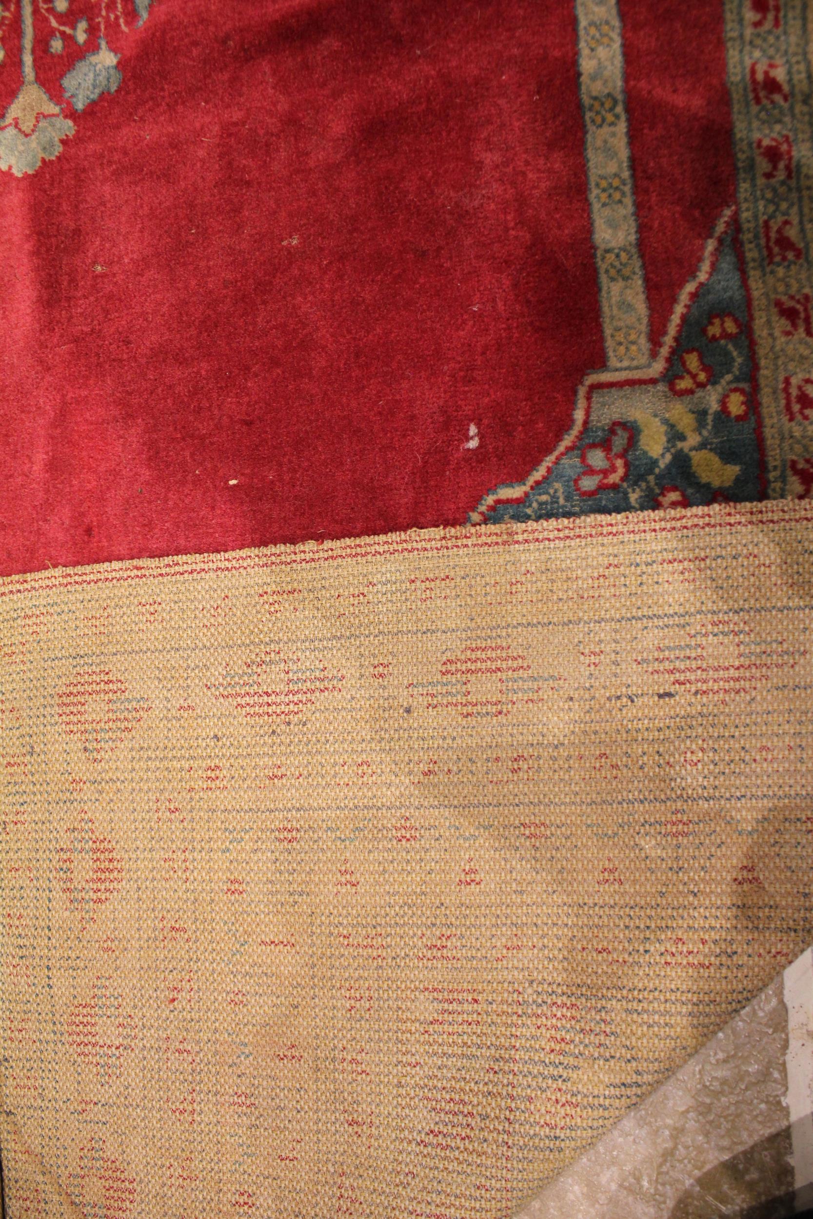 A Persian bamboo silk prayer rug, the central red field with a foliate urn, flanked by vertical - Bild 2 aus 2