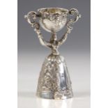 A Victorian imported silver wager cup, Berthold Muller, London 1897, modelled as a lady with twin