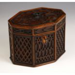 A George III mahogany blind fretwork tea caddy, of octagonal form, outlined with chequered